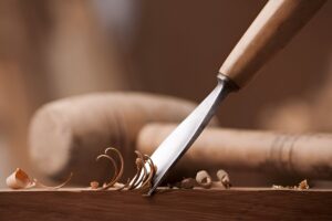 Traditional woodworking hand tools used to shape wood like hand plane and spoke shave