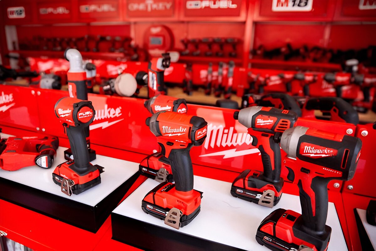 Close-up of a Milwaukee power tool with red casing and black grip, showcasing the brand's industrial design and build quality