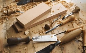 Traditional woodworking hand tools used to shape wood like hand plane and spoke shave