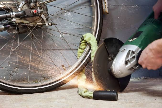How to Cut an OnGuard Lock with a Rotary Tool Safely Rotary tool cutting through a hardened OnGuard bike lock secured to a metal bike rack