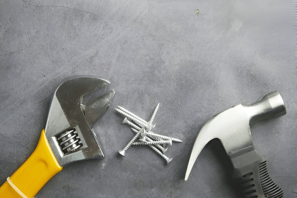 “Adjustable wrench gripping a metal bolt”